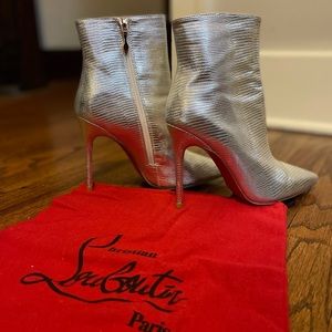 Silver booties with red bottoms